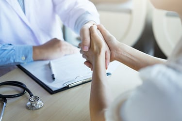 patient shaking hand with doctor